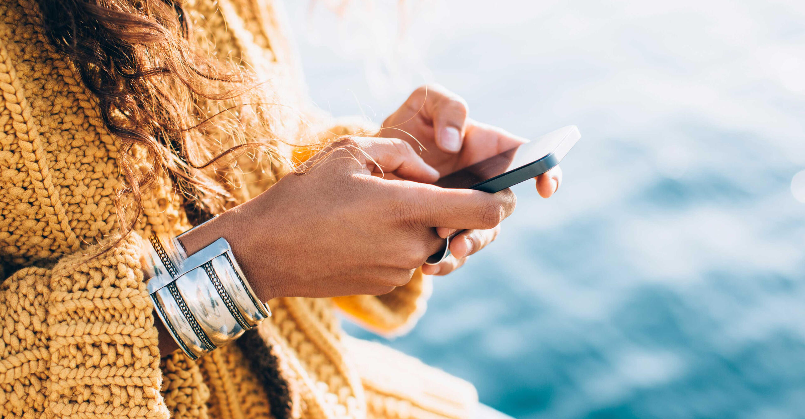 woman using phone to manage projects