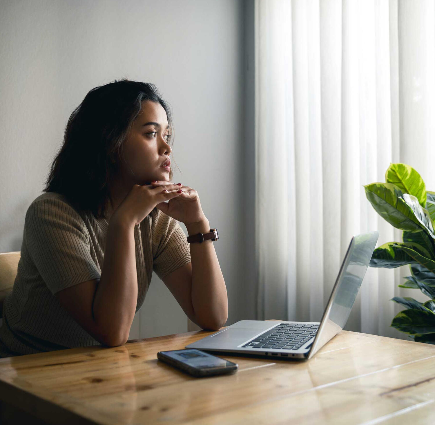 woman staring out the window